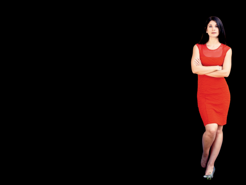 Image of Mary Anne Franks wearing a red dress against a black background