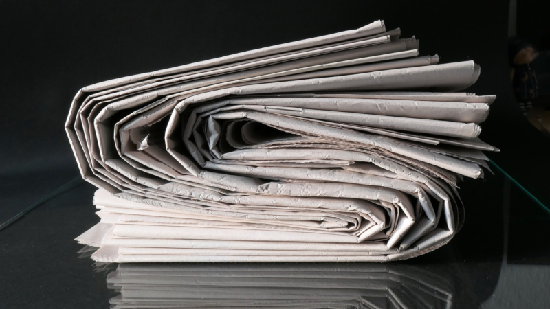 Several newspapers rolled up
